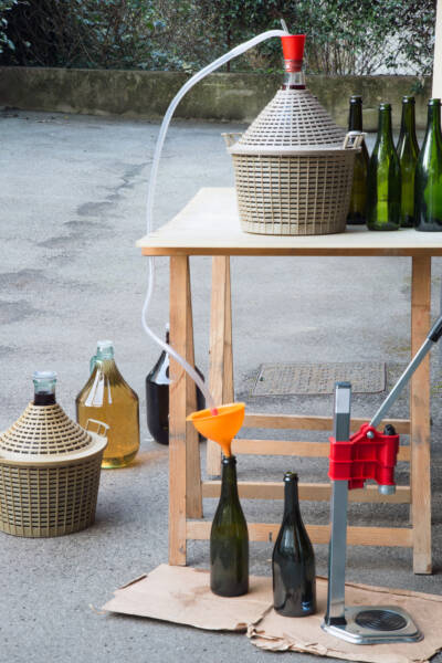 homemade wine bottling with the Carboy and glass bottles