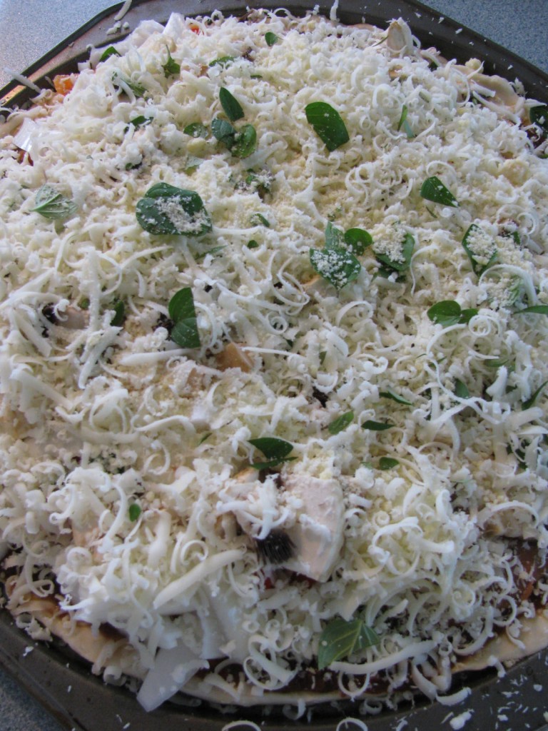 Homemade Pizza I added peppers, onions, mushrooms and lots of mozzarella cheese