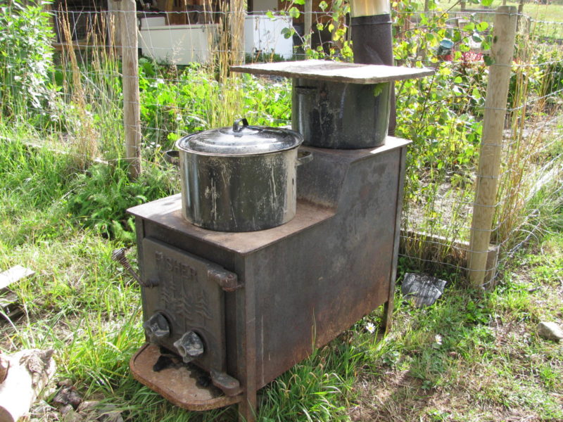 a woodstove cooking vegetables to feed farm animals