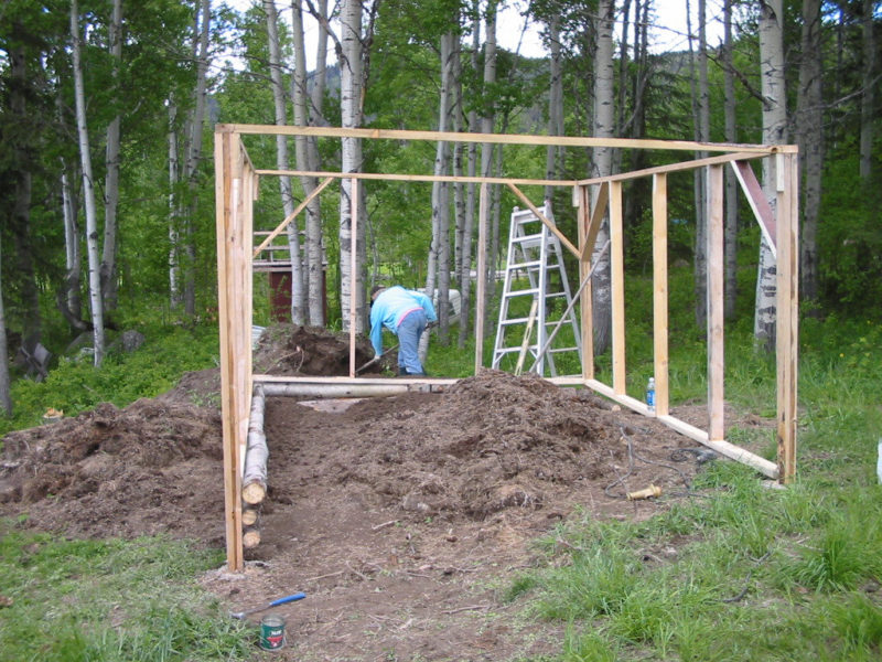 greenhouse frame around a compost pile