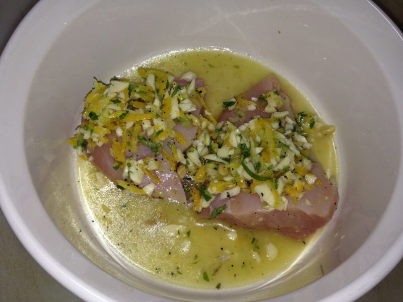 Mediterranean Lemon Chicken in a dish, ready to be cooked.
