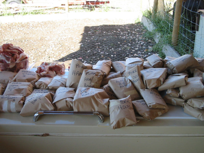 Butchered and papered cuts of meat from pigs.