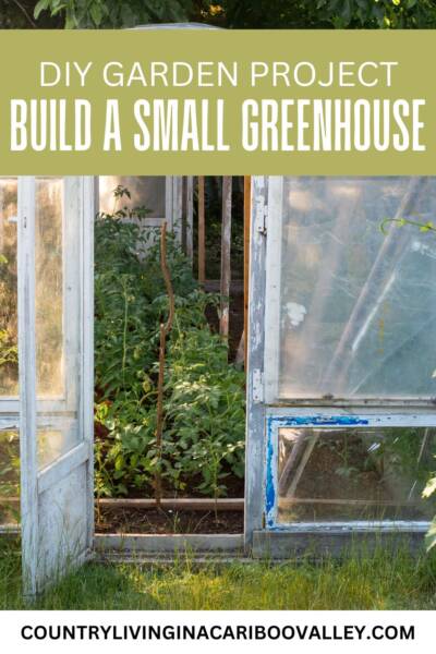 A small DIY greenhouse with an open door and plants growing inside.