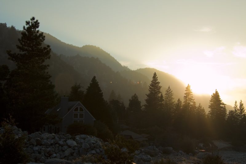 A house sits alone deep in the mountains