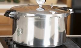 a pressure canner sits on a stove