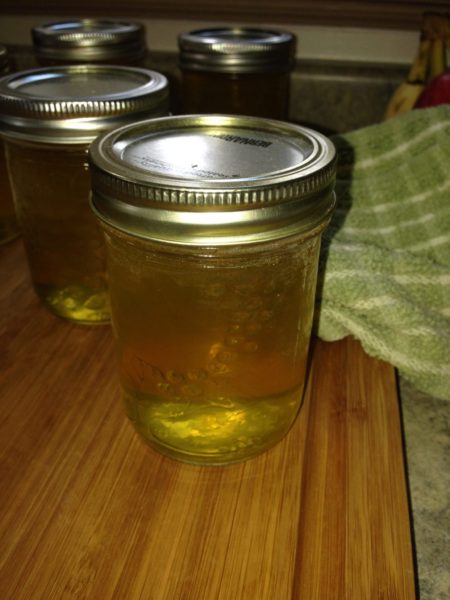 A mason jar of dandelion jelly.