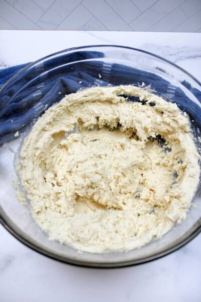 Thick batter of Dutch butter cake in a bowl.