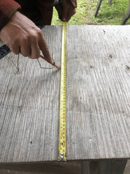 measuring the board to determine placement of barbed wire star