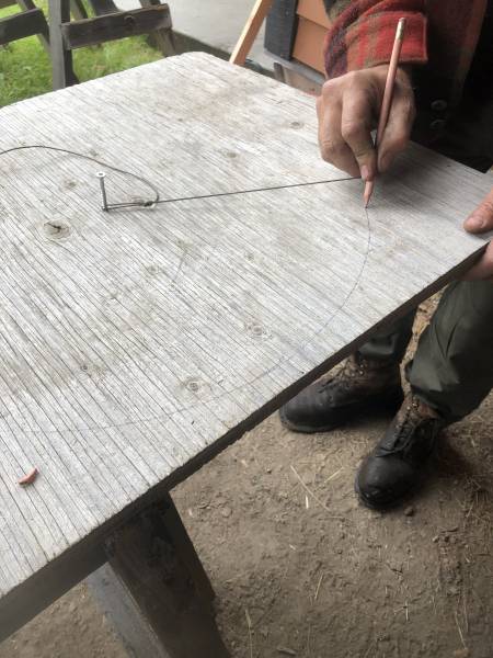 using a home made string compass to make a perfect circle shape