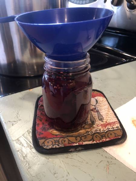 A jar full of beets sits waiting for the canning. 