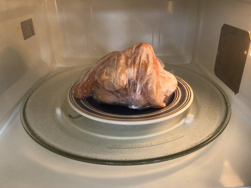 a meal of chicken in a bag in a microwave