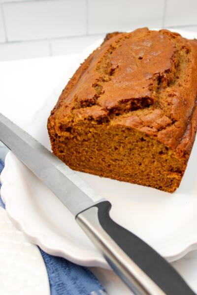 Pumpkin Banana Cranberry Bread ready to be cut in slices.