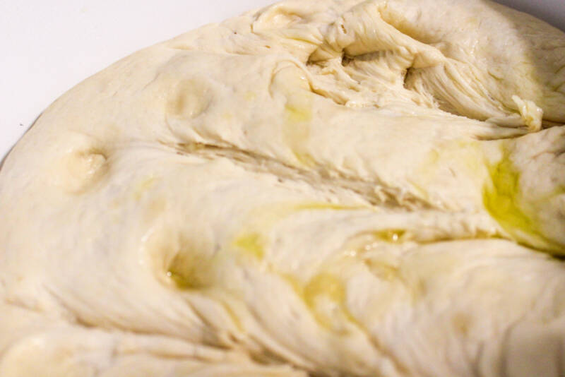 Oil drizzled on dough for bread