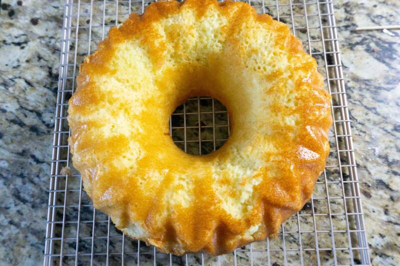 Cooled baked Lemon cake on a cookie rack.