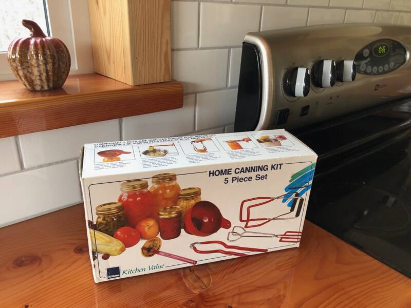 A 5-piece canning kit box on a counter.