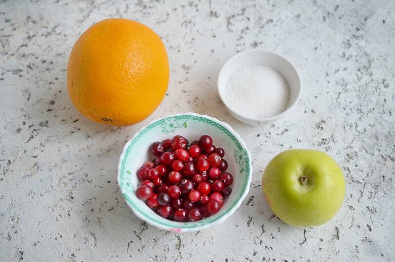 Ingredients for cranberry orange relish on a counter.