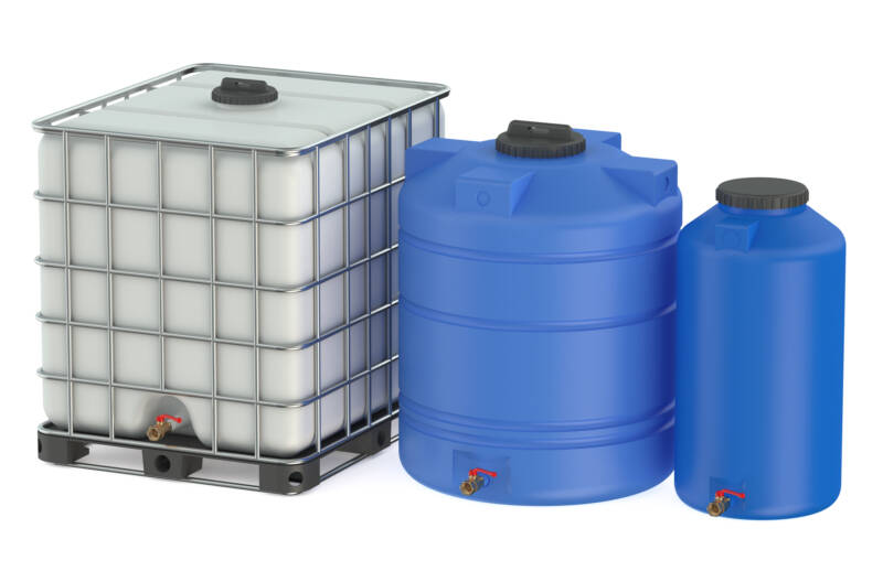 Three differently sized plastic barrels for collecting rain water.